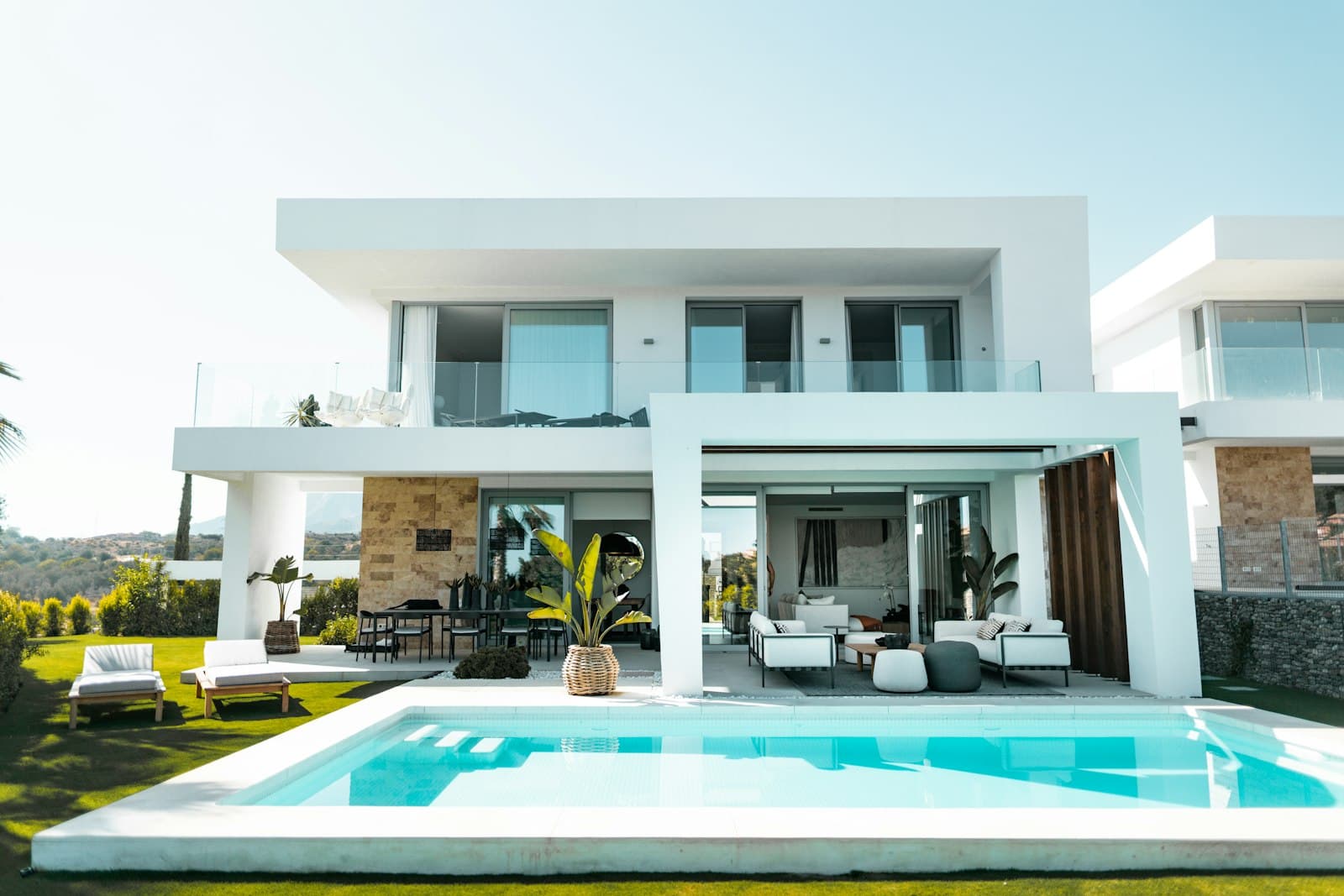 Bright family villa with pool terrace and sun loungers, the Arabian Ranches III lifestyle