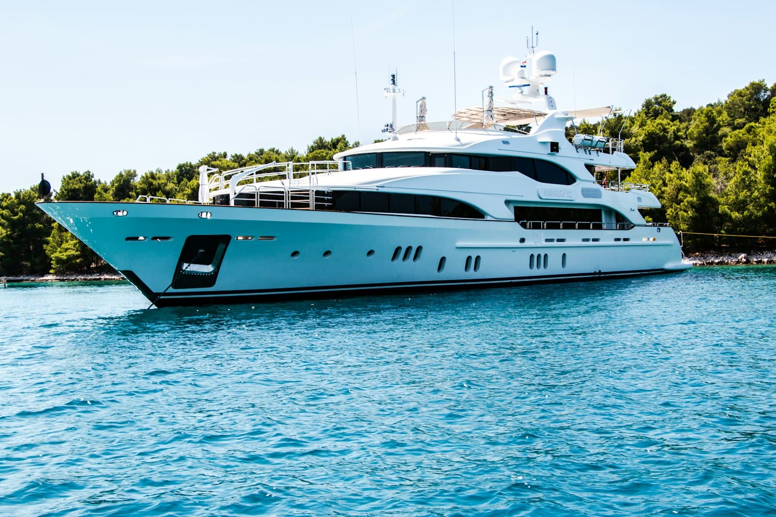 Superyacht on calm blue water, the lifestyle of Rashid Yachts and Marina at Mina Rashid